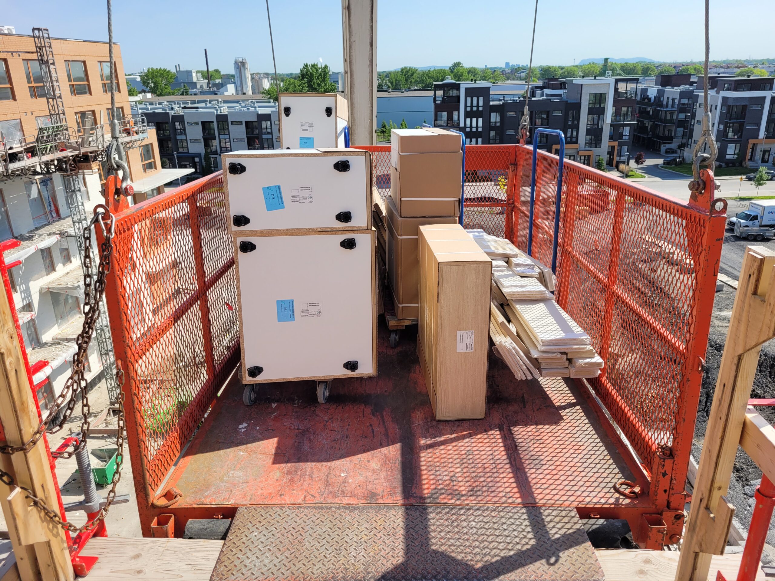 Kitchen cabinet delivery to construction site by Pro Action Transport ASP certified crew